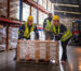 Three Employees Pushing a Bulk Order