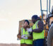 Two Men Wearing Carhartt Jackets and PPE