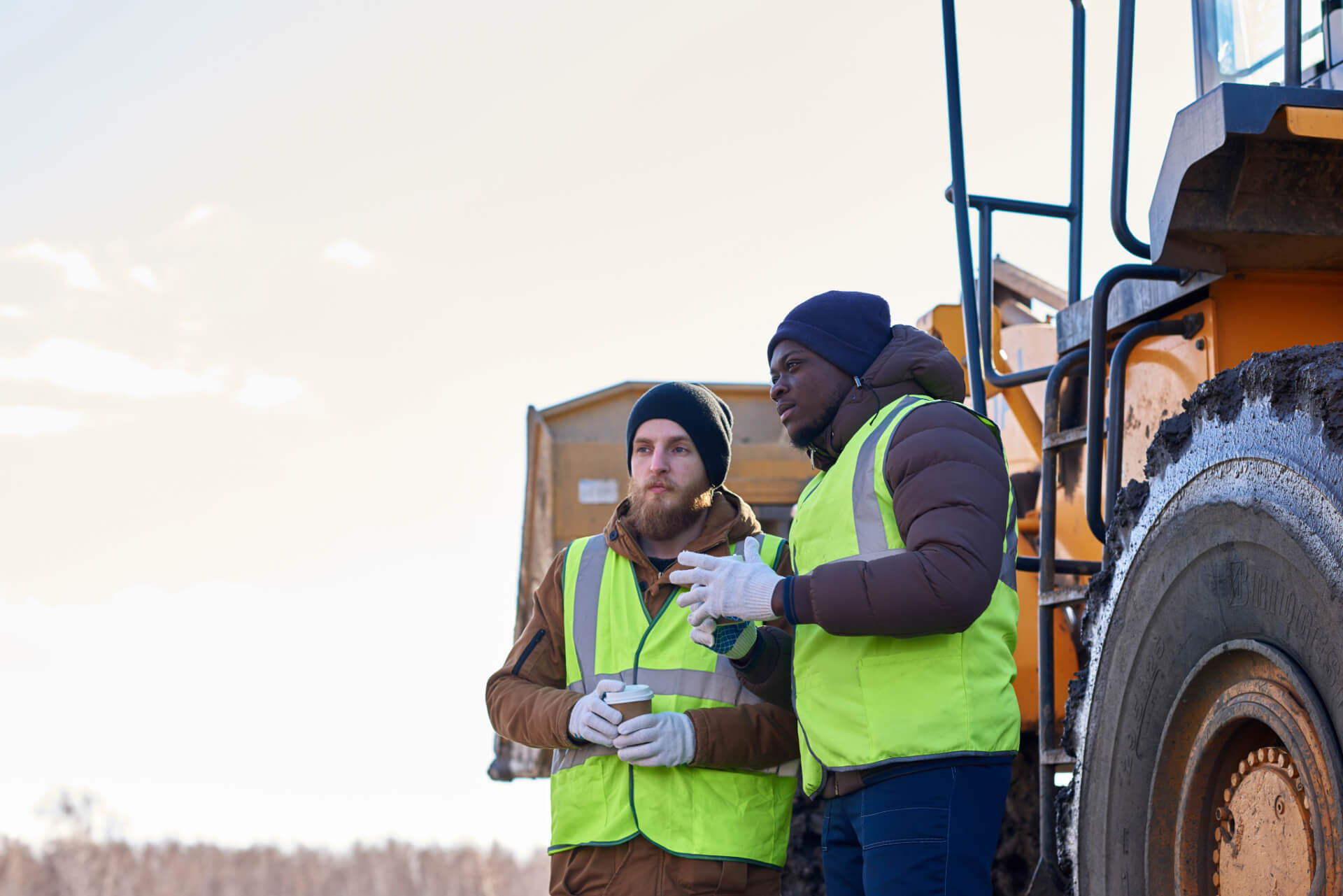 Two Men Wearing Carhartt Jackets and PPE