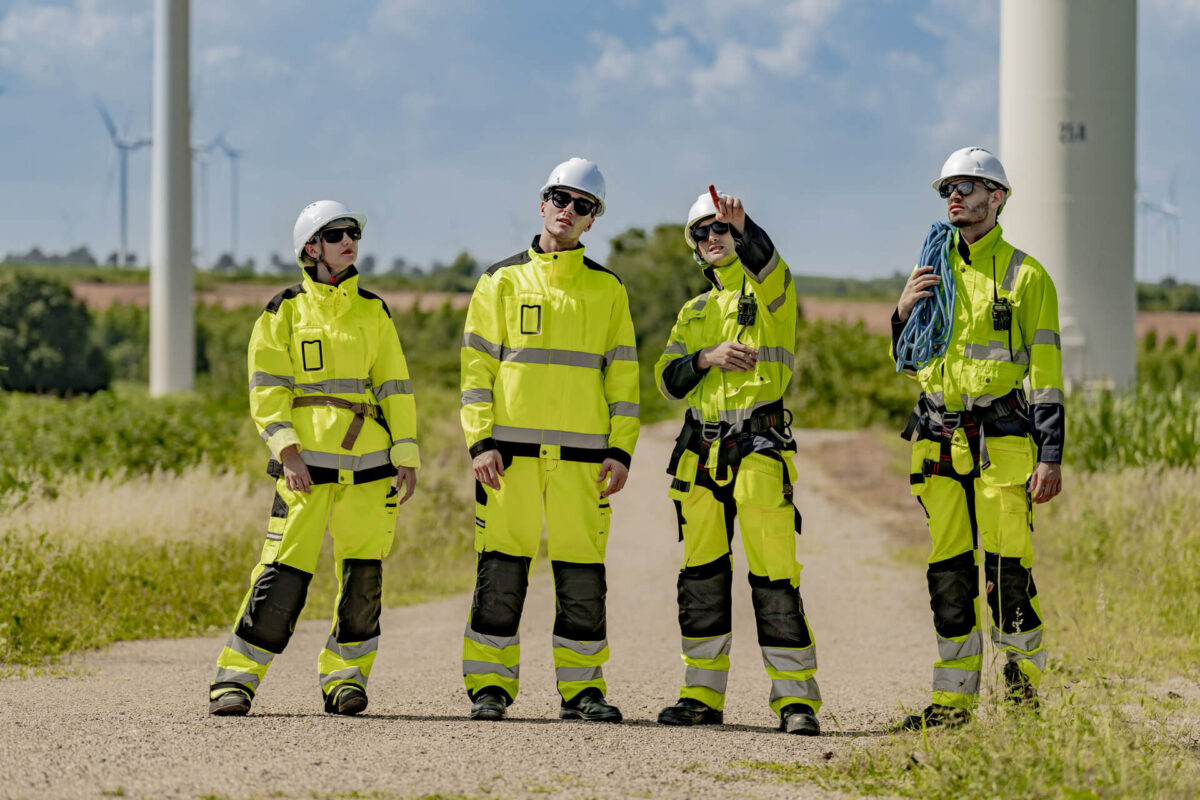 Four Employees Wearing High-Visibility PPE