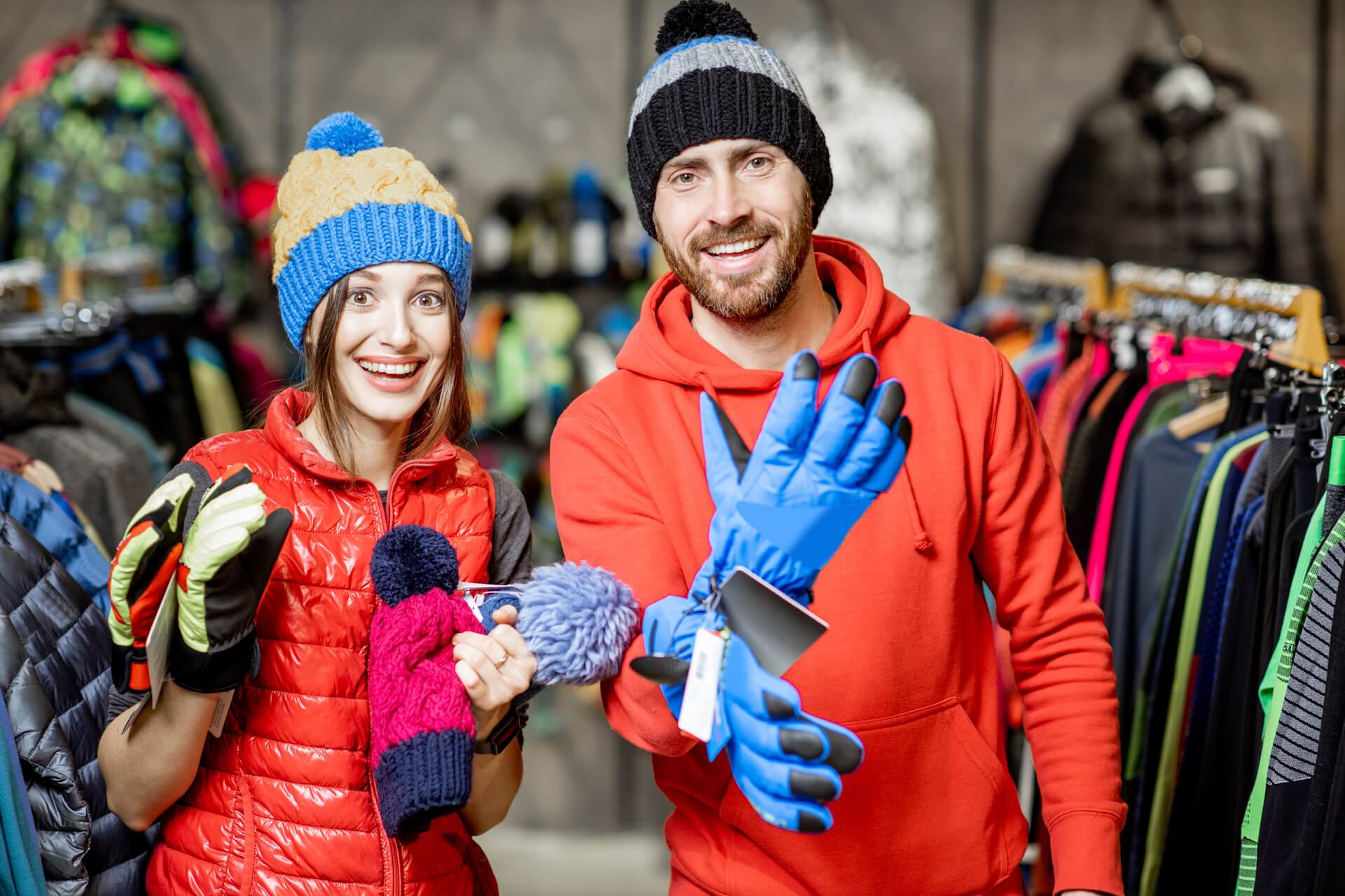Couple Trying on Winter Work Gear